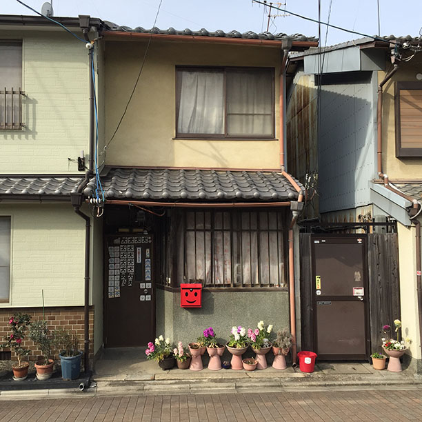 House with smiley-face mailbox